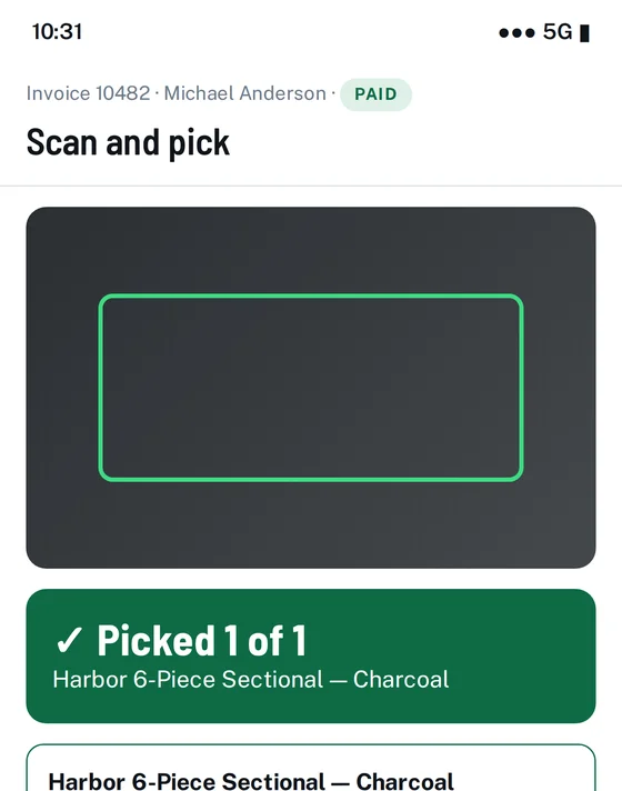 Phone scanner showing a green Picked 1 of 1 confirmation for the correct sofa