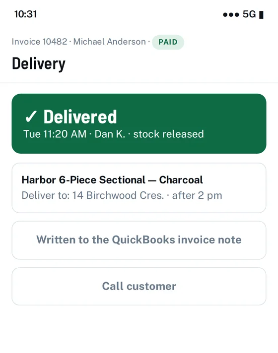 Phone screen confirming the order was delivered and stock released